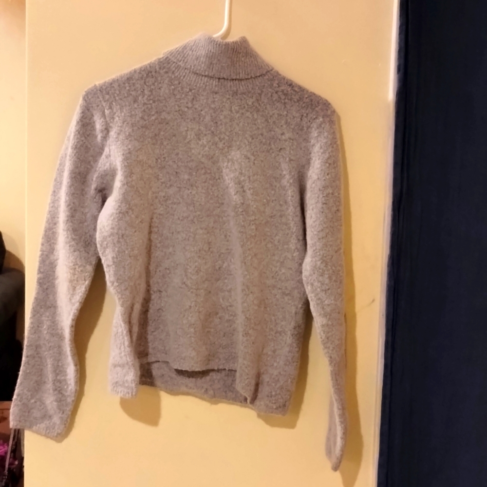 A. Comfortable grey turtle neck sweater